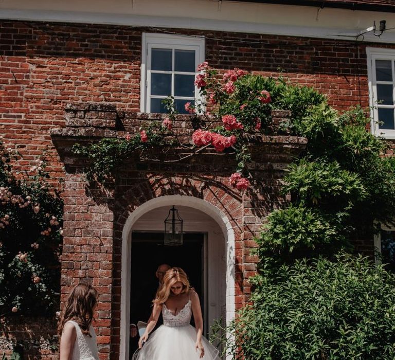 Bride makes her way to ceremony in Hayley Paige wedding dress