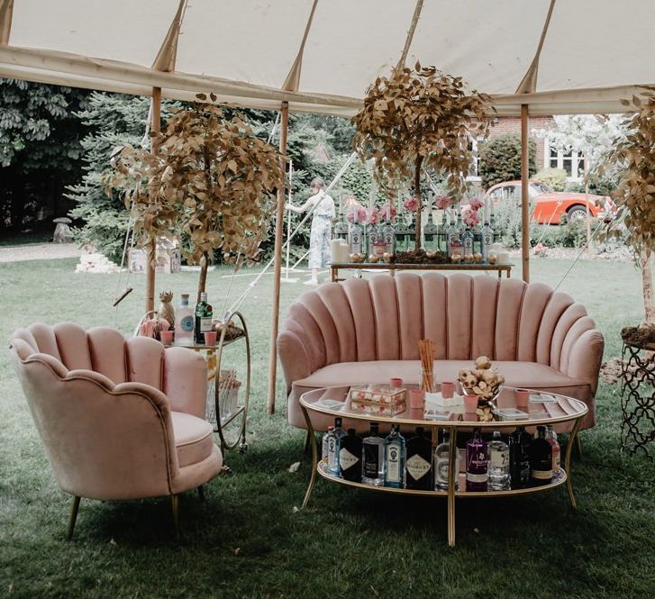 Pink sofa seating area with cherry blossom decor