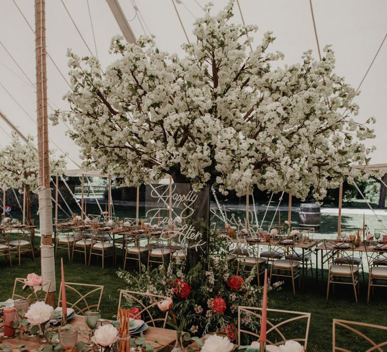 Stunning marquee wedding decor with cherry blossom