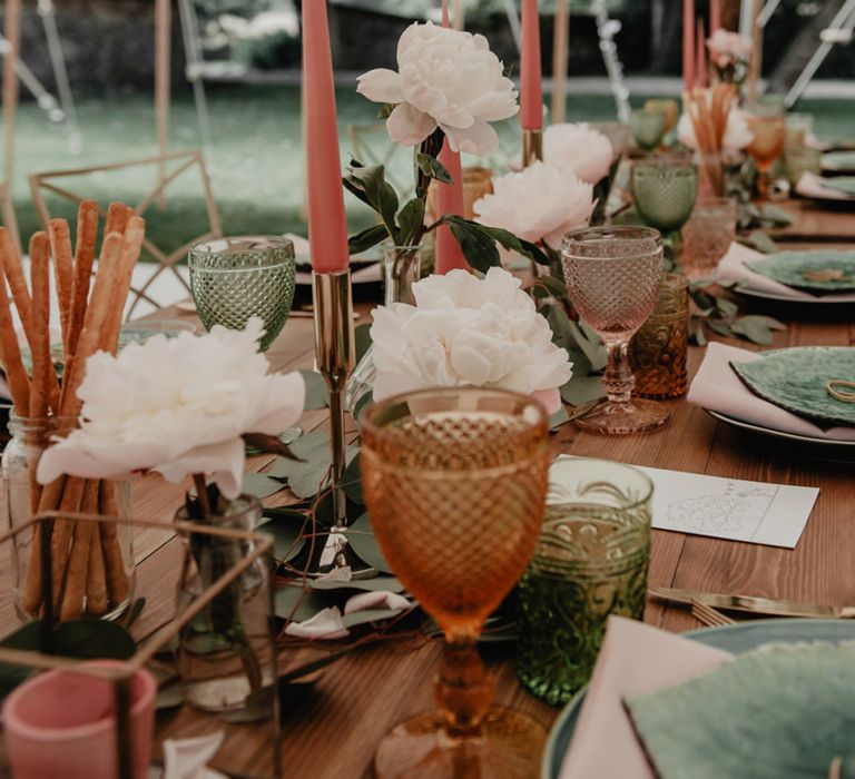 Wedding table decor with blush flowers and candles