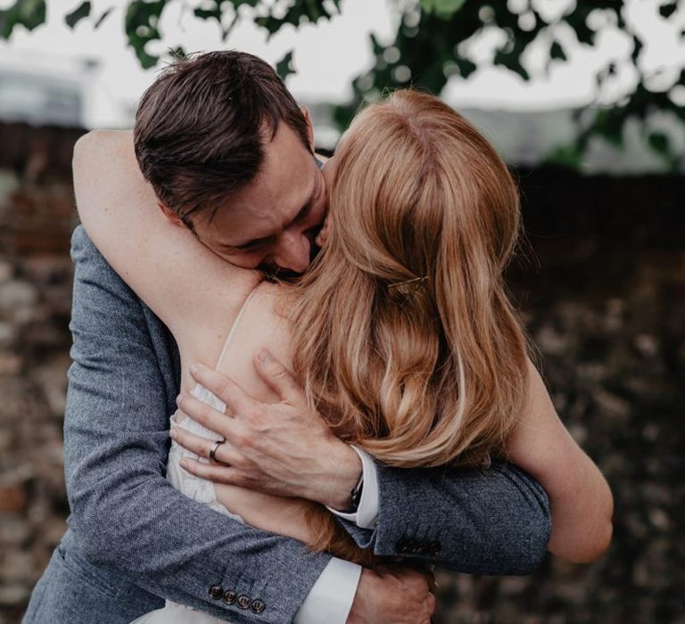 Bridal hair down at wedding with Prosecco wall