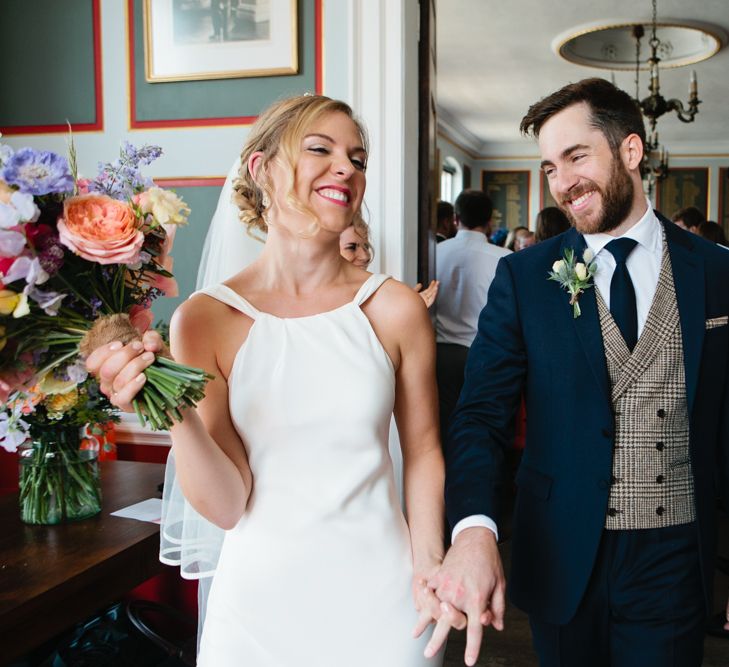 Bride in Charlie Brear Wedding Dress and Groom in Jack Bunney's Suit Just Married