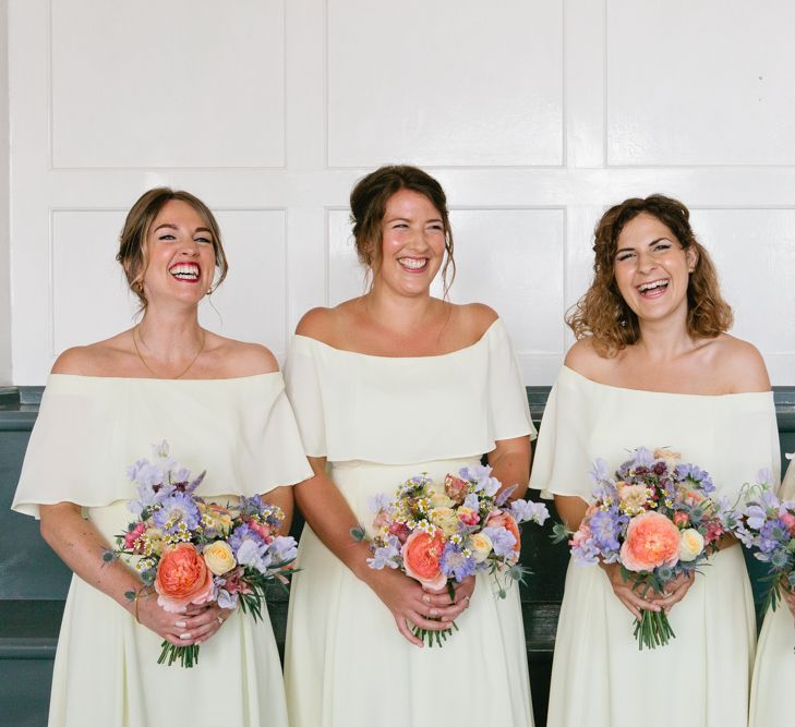 White Off The Shoulder Bridesmaid Dresses and Bright Bouquets