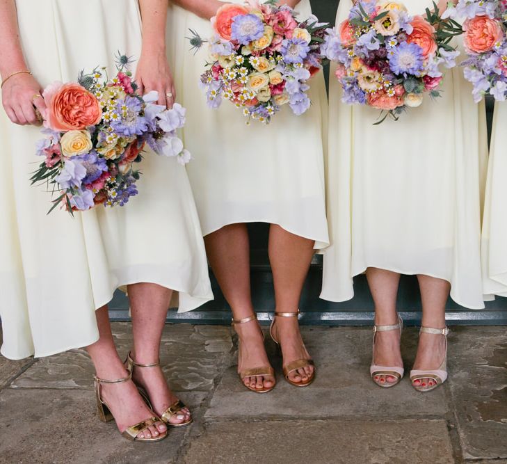 Bridesmaids in Different Gold Shoes