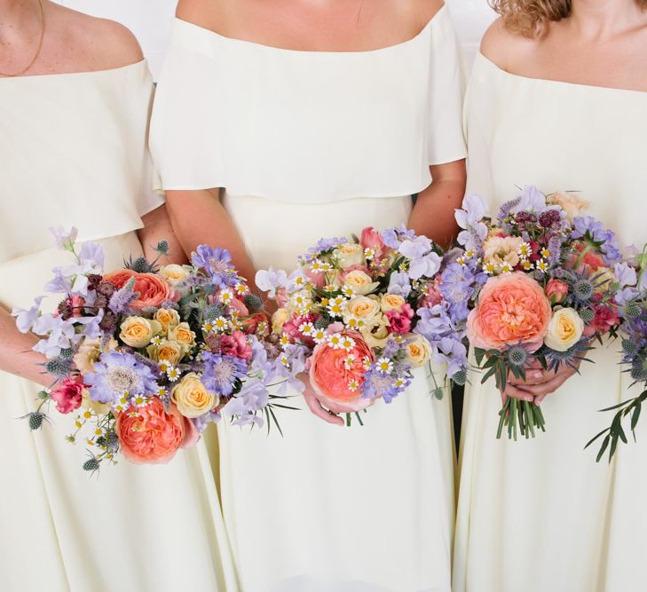 Bright Spring Wedding Bouquet with Coral David Austen Roses, Yellow Spray Roses and Blue flowers