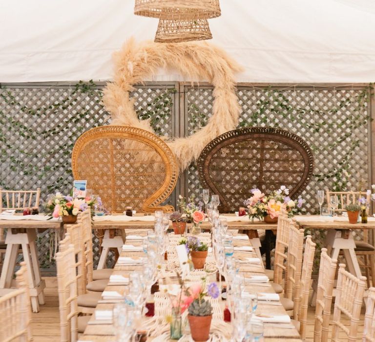 Peacock Chairs, Pampas Grass Hoop, and Rope and Wicker Lamp Shade Installation Wedding Reception Decor