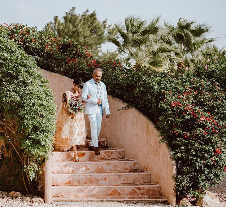 Bride makes her way to outdoor wedding ceremony