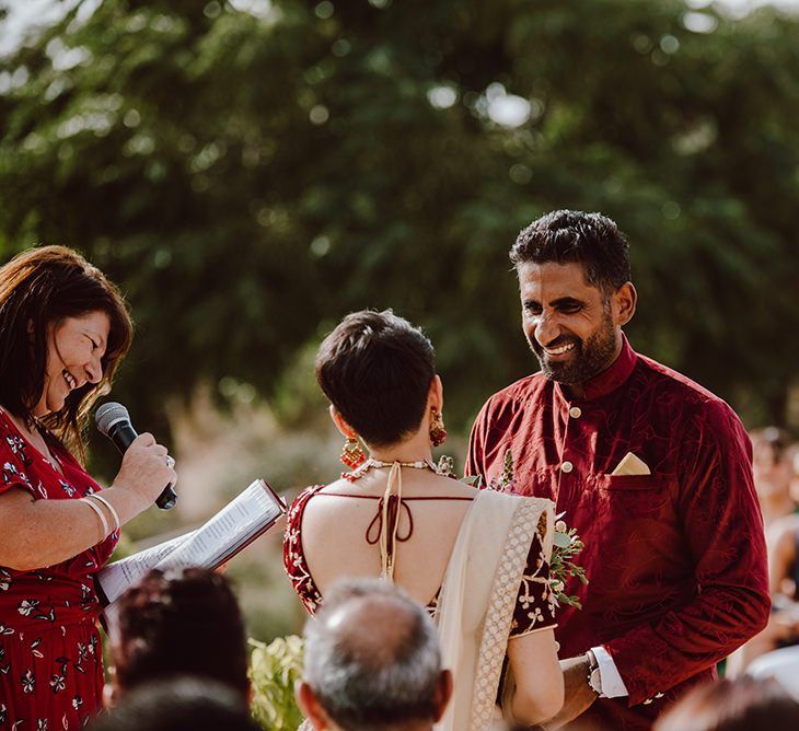 Bride and groom exchange vows in Indian dress