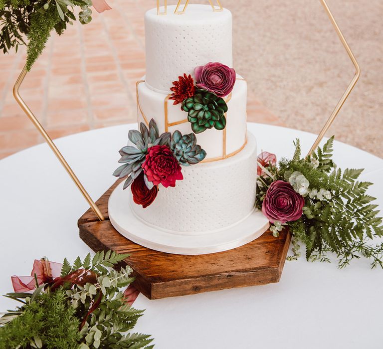 Geometric wedding cake with gold detail