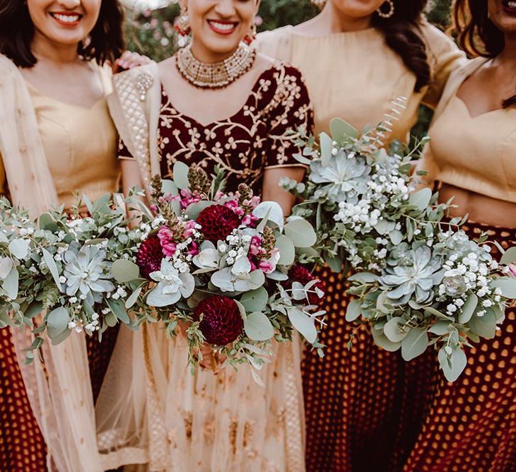 Bridal bouquet with Indian dress and foliage bouquets for bridesmaids