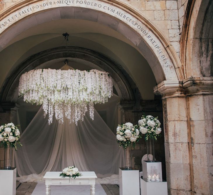 Wedding Ceremony Altar Flowers with White Floral Chandelier and Tall Floral Arrangements