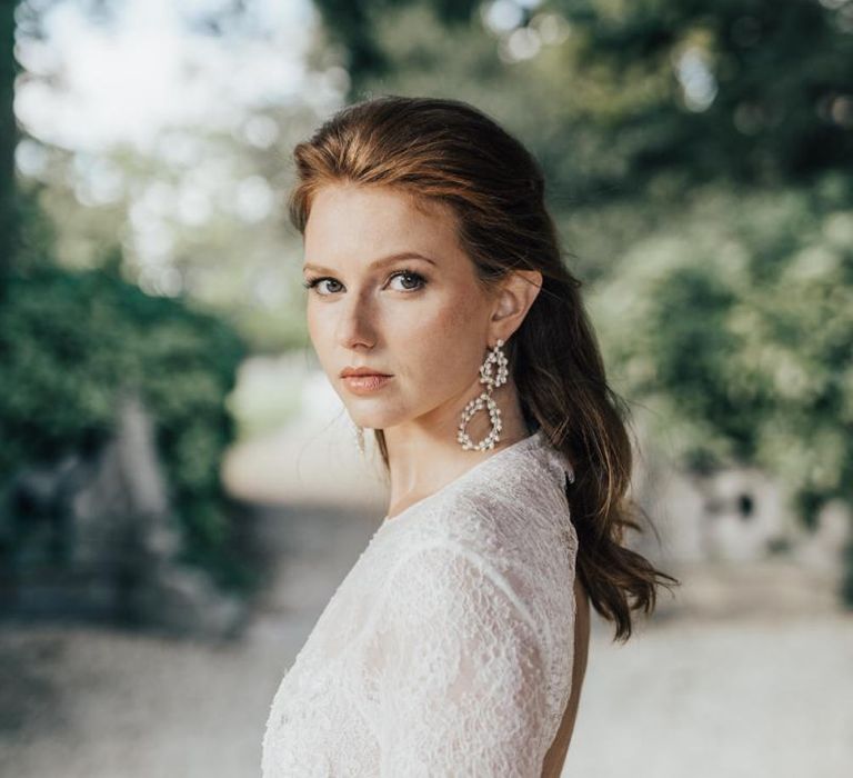 Delicate Lace Emma Beaumont Wedding Dress and Dangly Hermione Harbutt Earrings