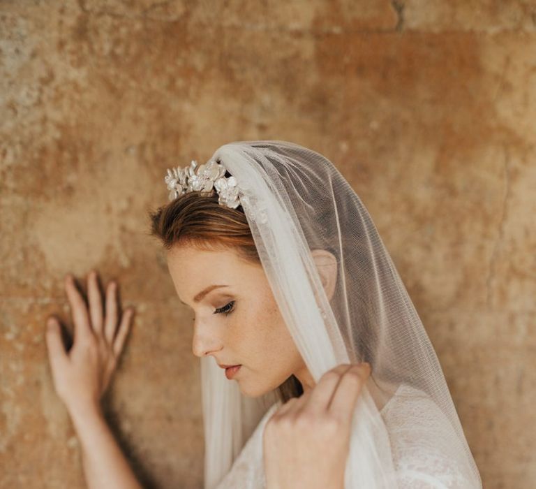 Bride Wearing an Iridescent Floral Headdress with a Wedding Veil