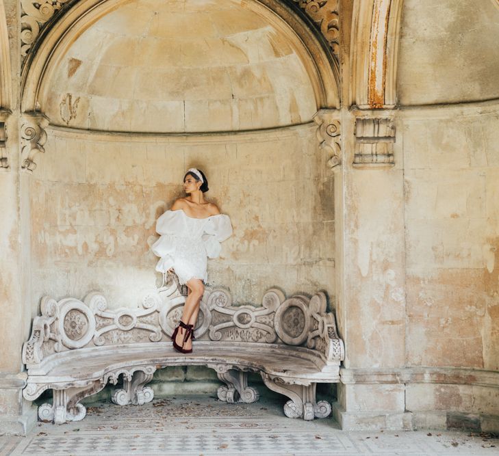 Bride in Short Puff Sleeve Wedding Dress and Red Velvet Shoes