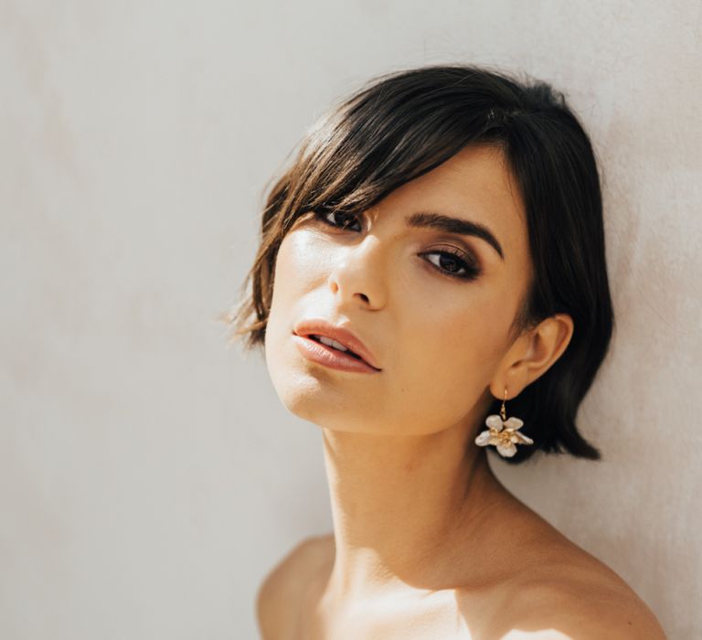 Bride with Short Bobbed Hair and Sweeping Fringe Wearing Flower Earrings