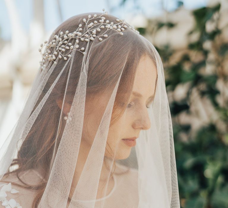 Bride Wearing a Delicate Wedding Veil with Pearl Crown Headdress on Top