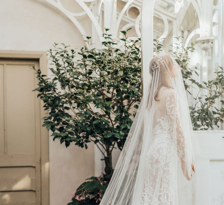 Elegant Bride in Lace Emma Beaumont Wedding Dress and Full Cathedral Length Wedding Veil