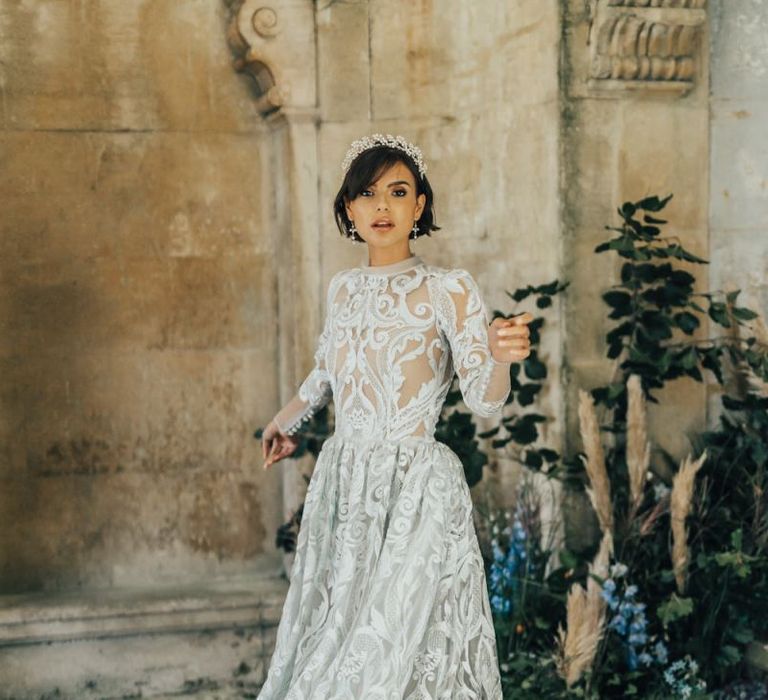 Bride in Emma Beaumont Lace Wedding Dress with Long Sleeves and Alice Band