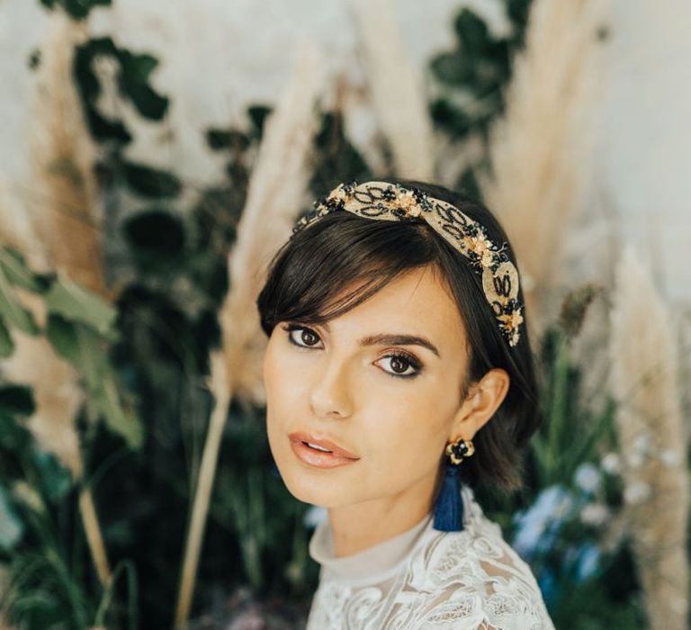 Beautiful Bride with Natural Make Up Wearing Tassel Earrings and Complementary Gold Headband