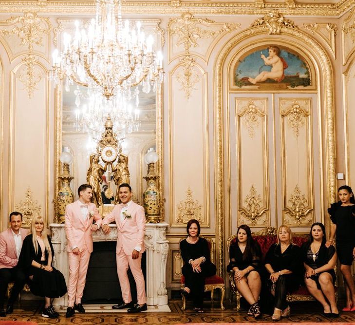 Family photograph in grand ceremony room in Paris with golden and ornate styling