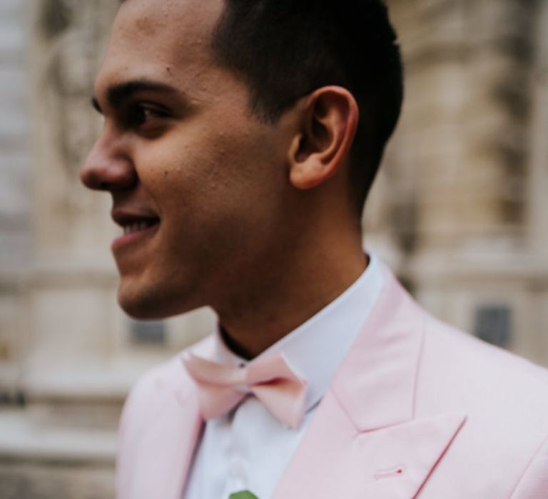 Pink bow tie and white rose buttonhole for same-sex celebration in Paris