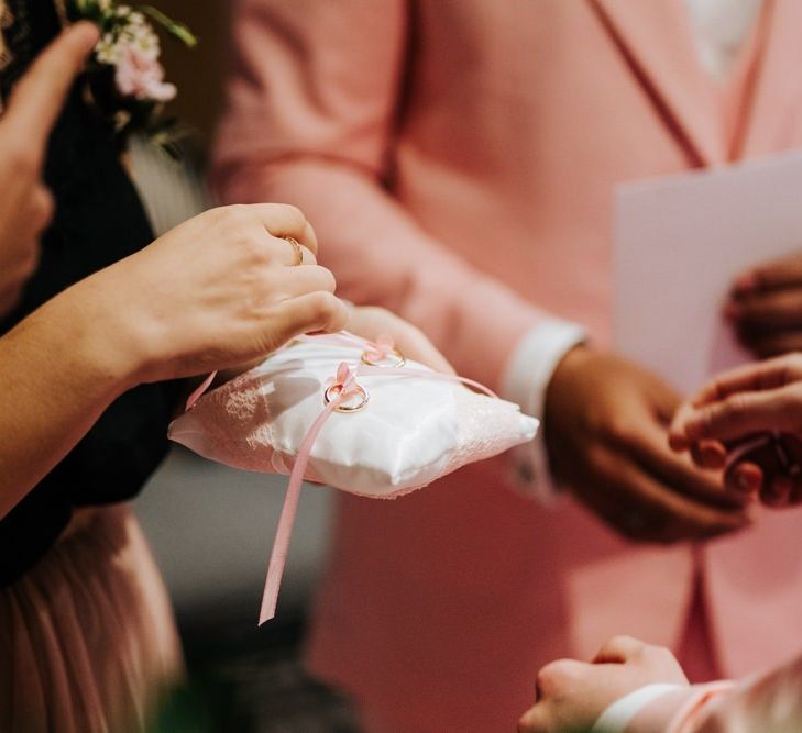 Ring cushion with pink ribbon detailing at same-sex ceremony in Paris