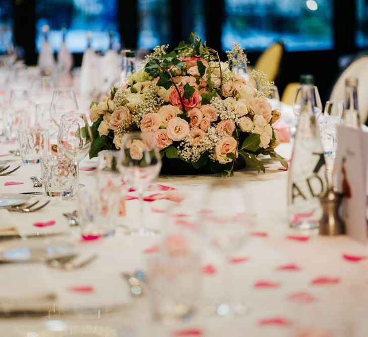 Table setting decor with white and pink rose floral arrangement at intimate Paris reception