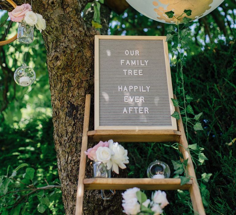 How to create a simple DIY Family Tree with wedding photos using embroidery hoops, ribbon, polaroid photos, mini pegs and flowers