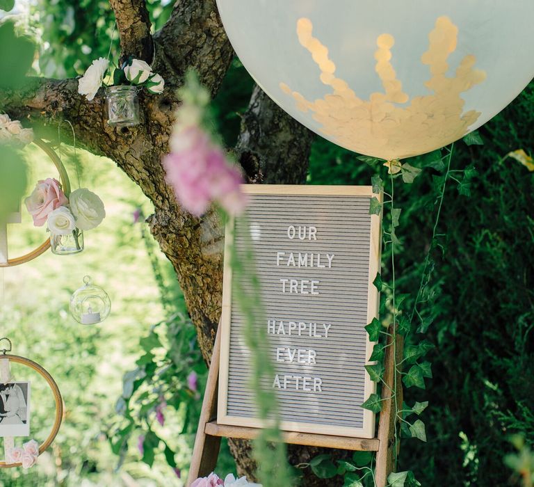 How to create a simple DIY Family Tree with wedding photos using embroidery hoops, ribbon, polaroid photos, mini pegs and flowers