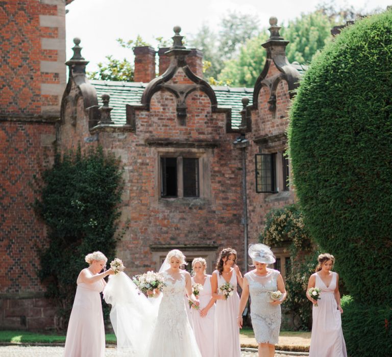 Bridal Party in Pink Maids to Measure Dresses and Bride in Pronovias Wedding Dress