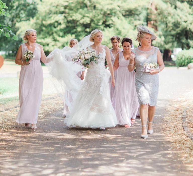 Bridal Party in Pink Maids to Measure Dresses and Bride in Pronovias Wedding Dress