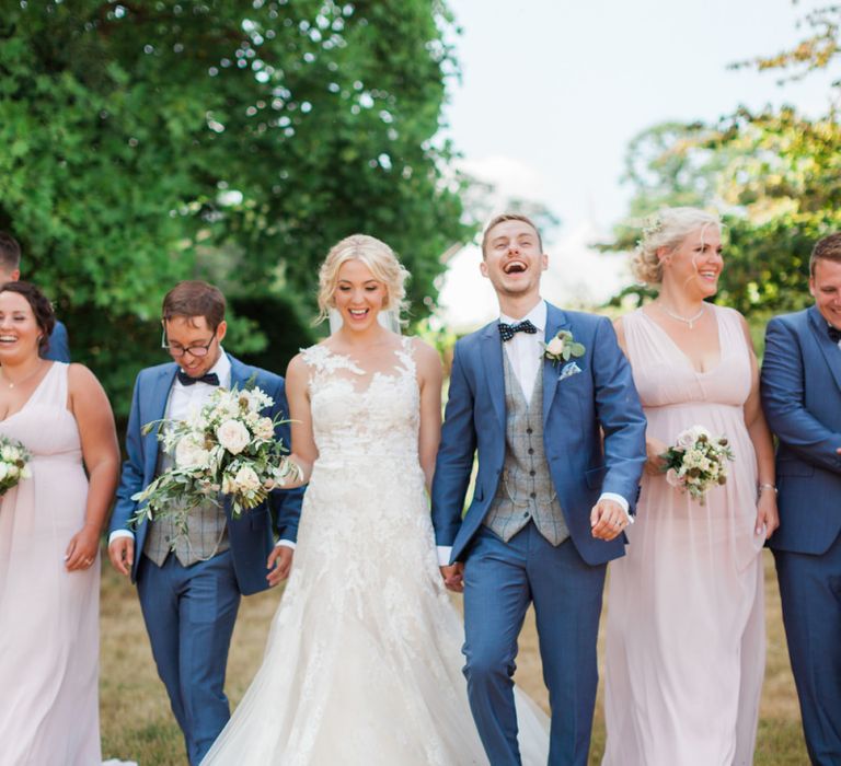 Wedding Party Portrait with Bridesmaids in Pink Dresses and Groomsmen in Navy Suits