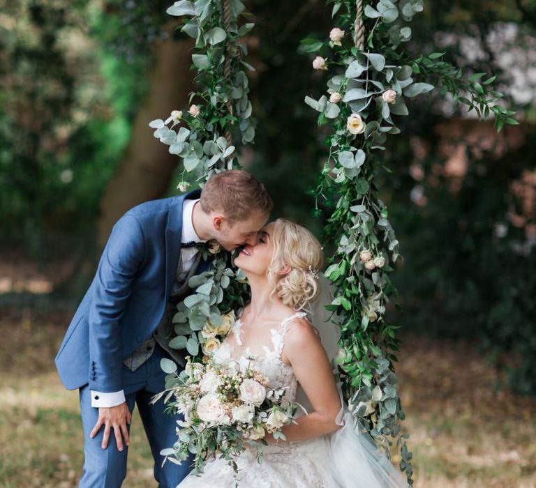 Bride and Groom Portrait on a Swing