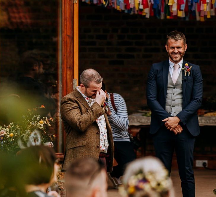 Groom in Brown Wool Jacket and Floral Shirt Getting Emotional At the Altar