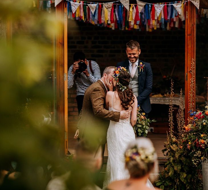 Bride Kissing Her Groom at the Altar