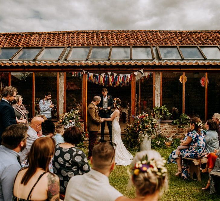 At Home Wedding Ceremony with Homemade Floral Bunting