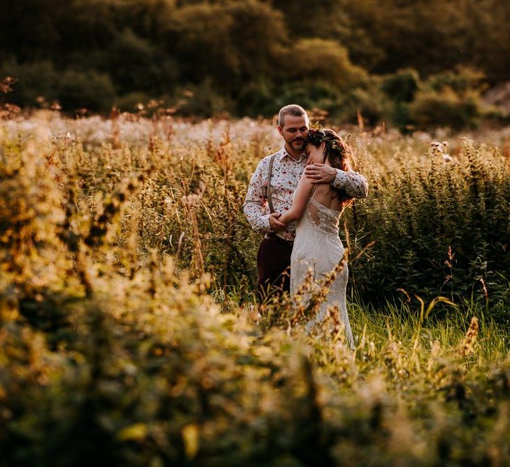 Bride in Sottero &amp; Midgley Wedding Dress and Colourful Flower Crown and Groom in Floral Shirt