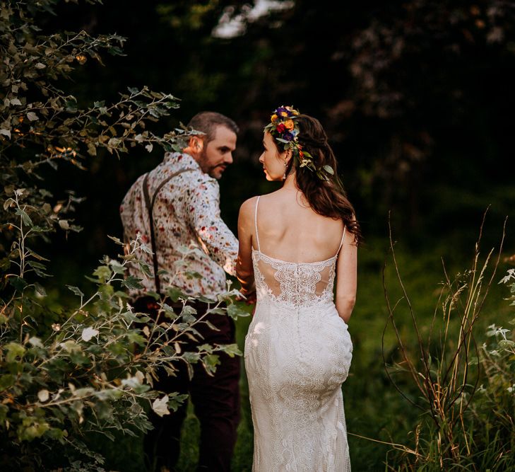 Bride in Sottero &amp; Midgley Wedding Dress and Colourful Flower Crown and Groom in Floral Shirt