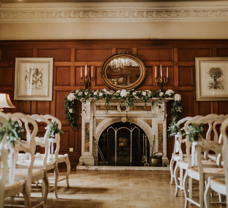 Aisle &amp; Altar Style | Greenery &amp; White Fireplace Mantle Wedding Flowers | Green, White &amp; Gold Wedding at Buckland Tout Saints, Devon |  Darina Stoda Photography