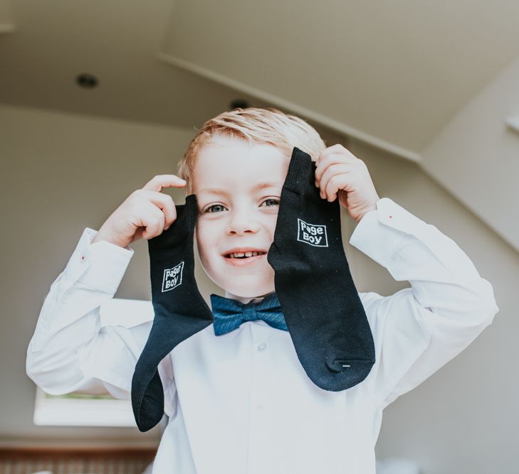 Page Boy &amp; Socks  Wedding Morning Preparations | Green, White &amp; Gold Wedding at Buckland Tout Saints, Devon |  Darina Stoda Photography