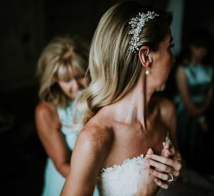 Bridal Morning Preparations | Bride in Pronovias Oringo Lace Bridal Gown &amp; Debenhams Hair Accessory | Green, White &amp; Gold Wedding at Buckland Tout Saints, Devon |  Darina Stoda Photography