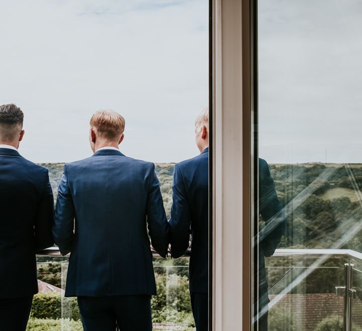 Groomsmen in Blue Suits | Green, White &amp; Gold Wedding at Buckland Tout Saints, Devon |  Darina Stoda Photography