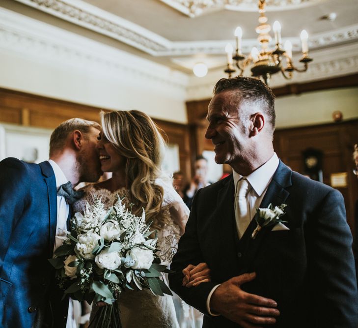 Wedding Ceremony | Bride in Pronovias Oringo Lace Bridal Gown &amp; Cape | Groom in Blue Marks and Spencer Suit | Green, White &amp; Gold Wedding at Buckland Tout Saints, Devon |  Darina Stoda Photography