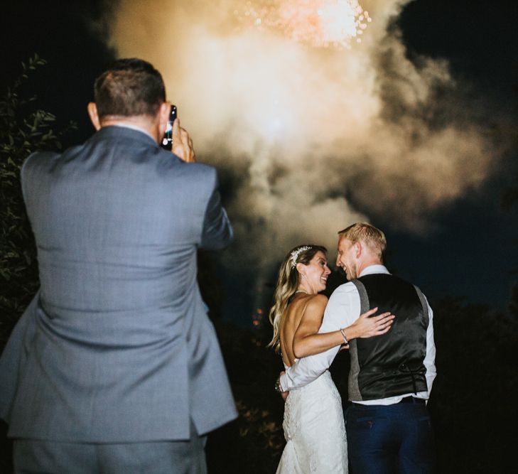 Surprise Fireworks Display | Bride in Pronovias Oringo Lace Bridal Gown &amp; Cape | Groom in Blue Marks and Spencer Suit | Green, White &amp; Gold Wedding at Buckland Tout Saints, Devon |  Darina Stoda Photography