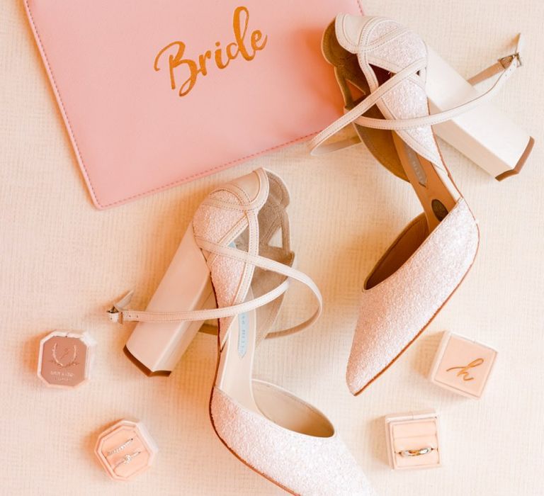 White wedding shoes with bride pouch