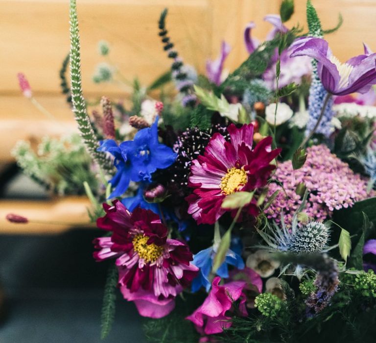 Bright wildflower bouquet to match floral moon gate arch