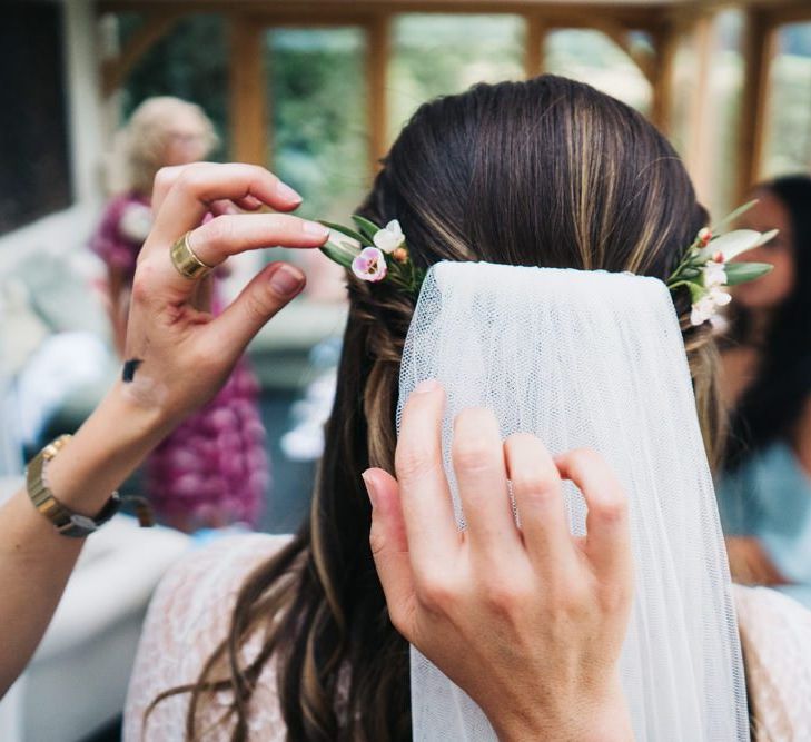 Bridal finishing touches with veil and floral hair pieces