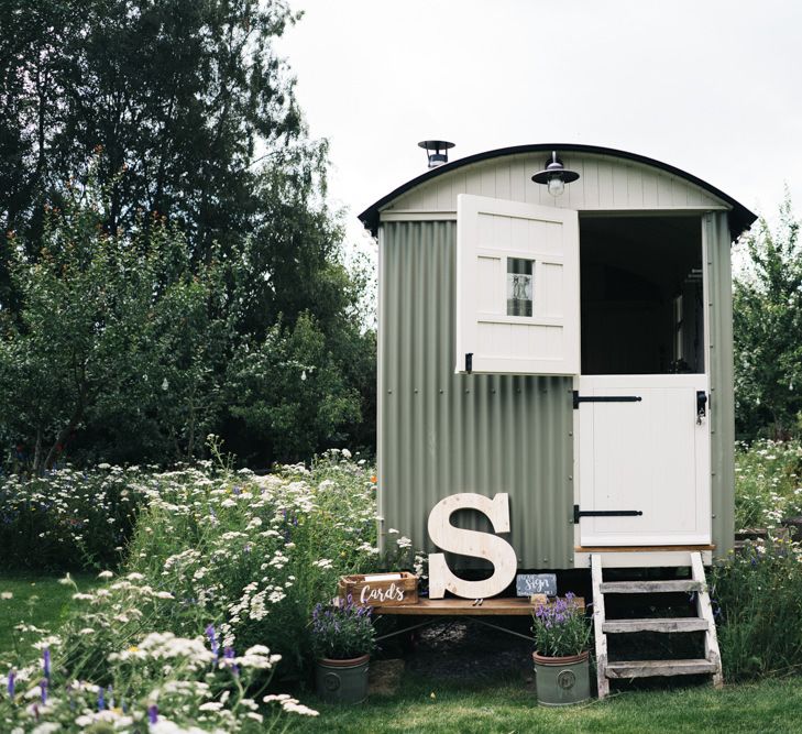 Beautiful wildflower decoration with rustic caravan