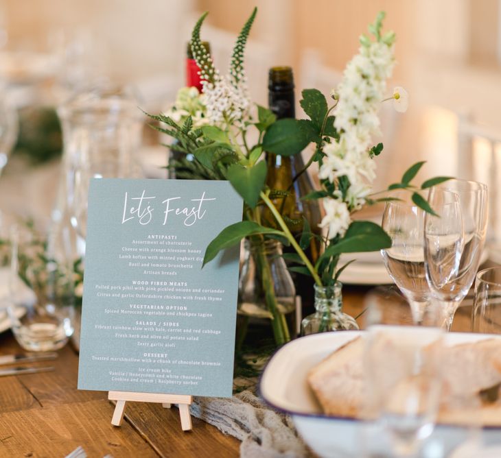 Wedding table stationery with white wedding flowers