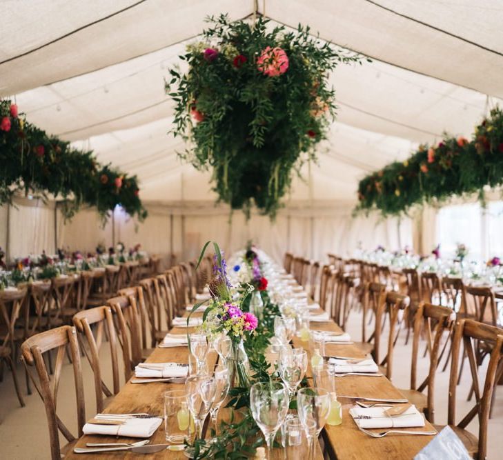 Beautiful marquee wedding with hanging flower installations